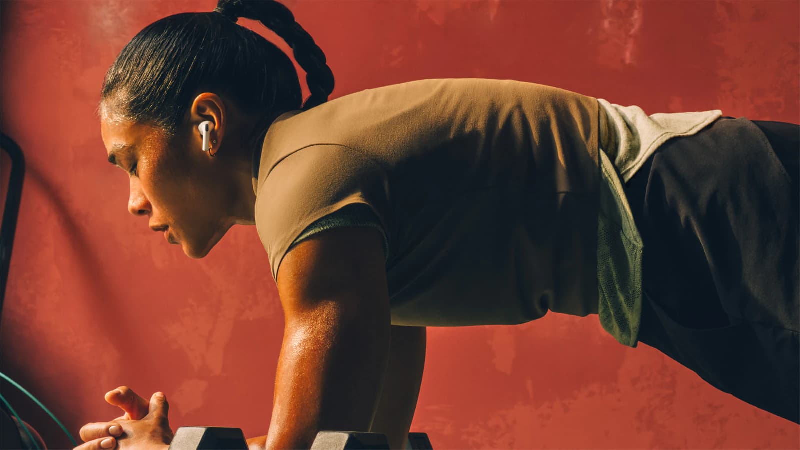 A person wearing Apple AirPods Pro 3