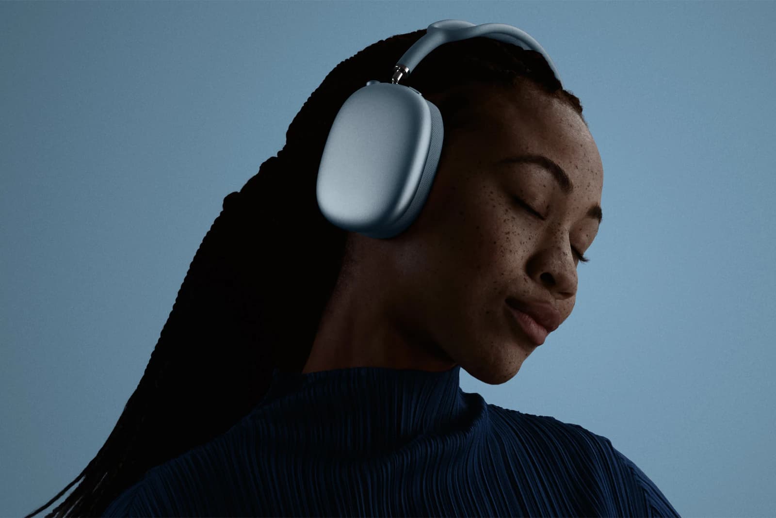 A person wearing Apple AirPods Max 2