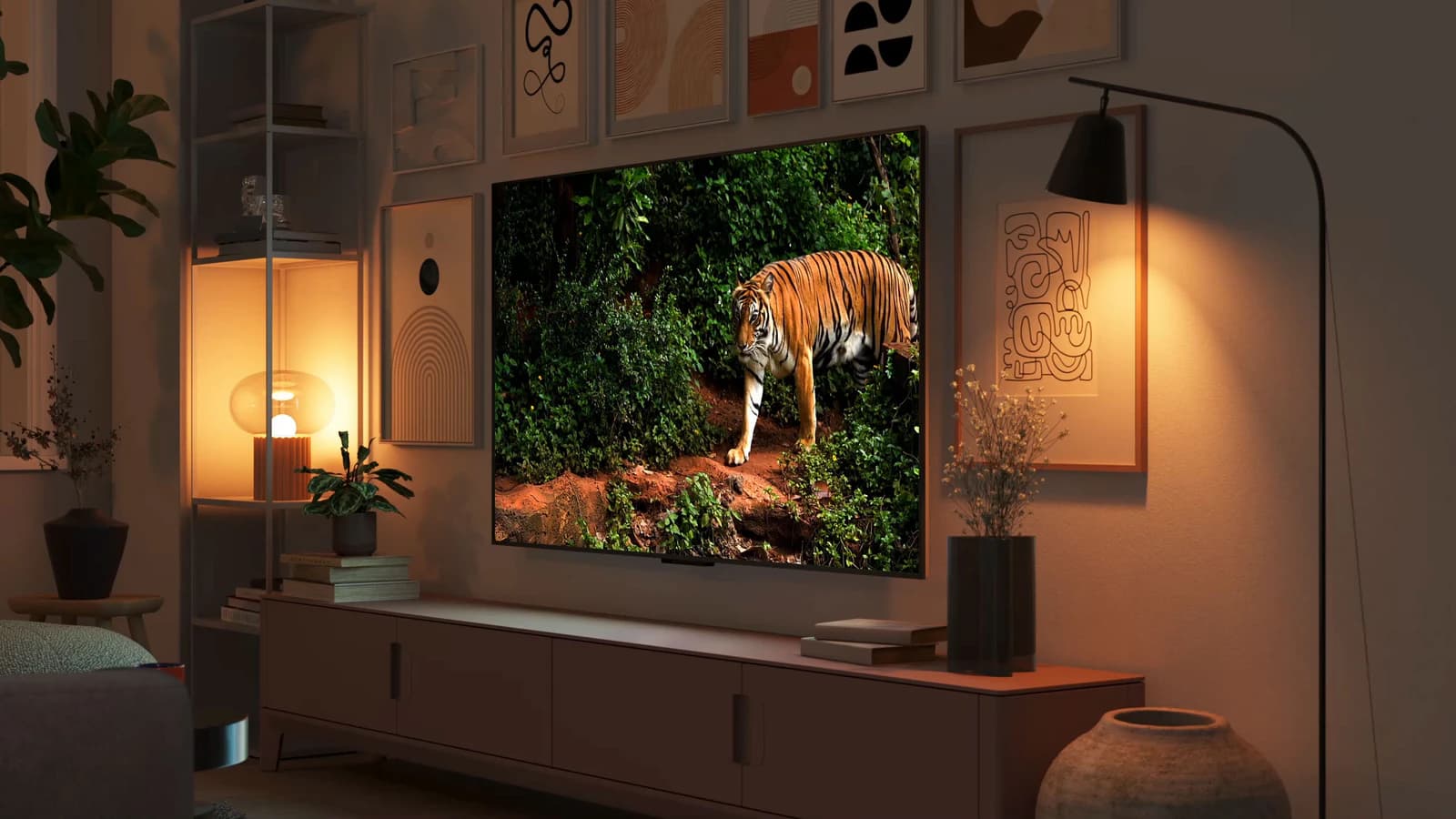 Amazon Fire TV Omni Mini-LED on a wall in a warmly lit living room